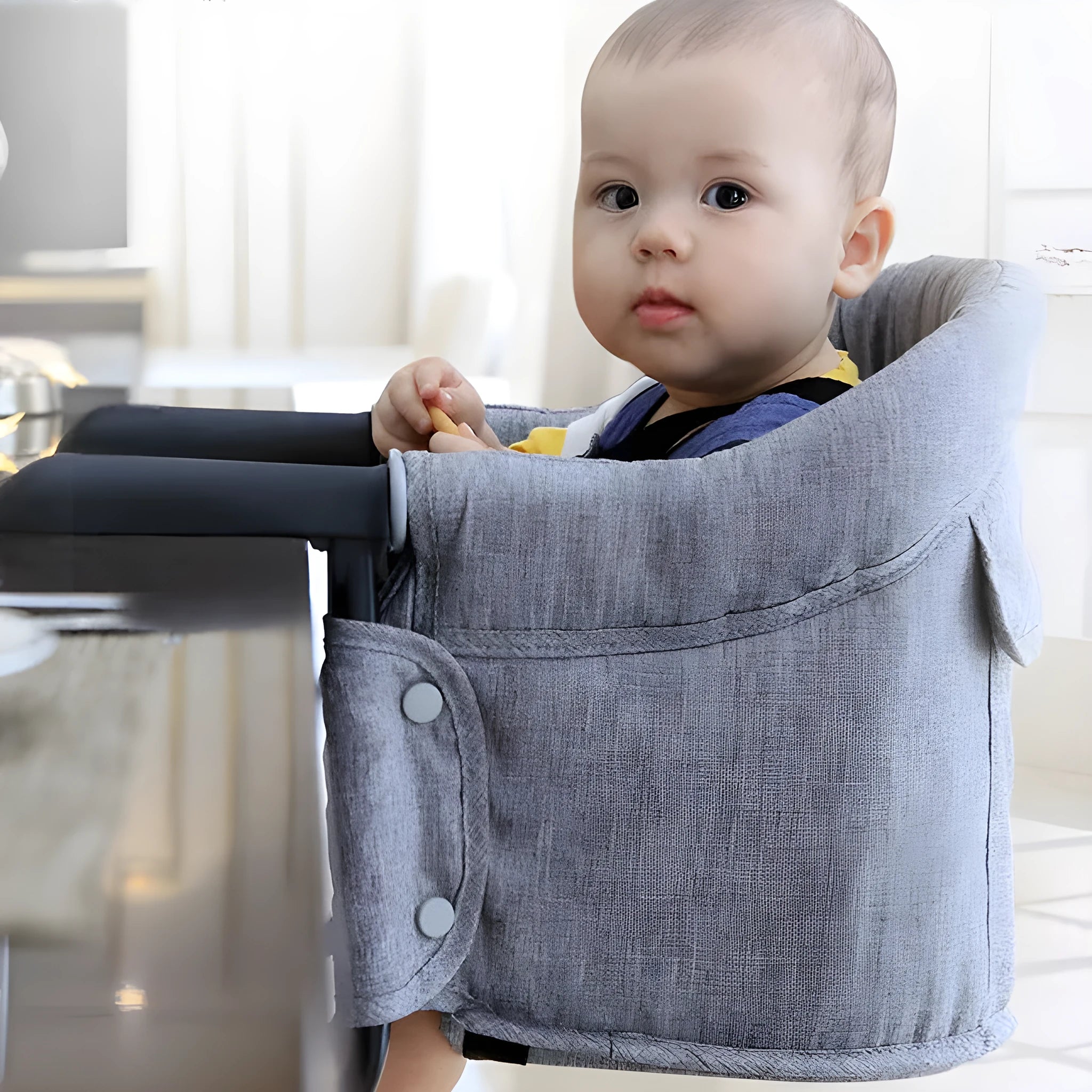 Portable baby high chair seat cover with safety belt in blue colour expanded on dining chair