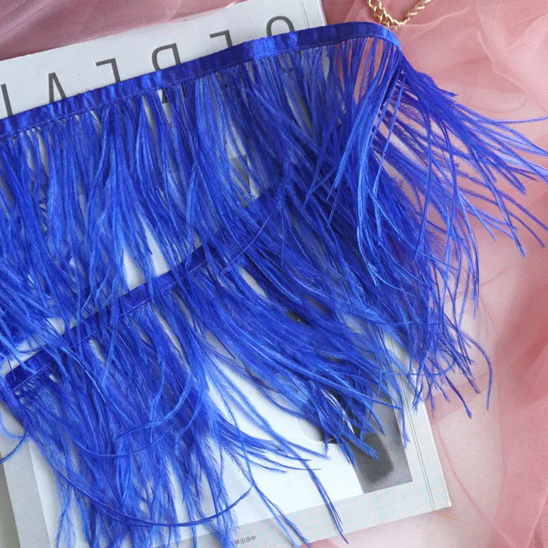 Decorative feather cloth strip in multiple colours including white, black, and mint green for DIY clothing and craft projects