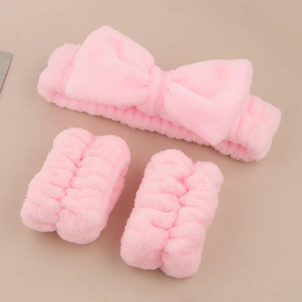 Three-piece facial skincare set showing a nylon brush and a coral fleece hair band in purple.
