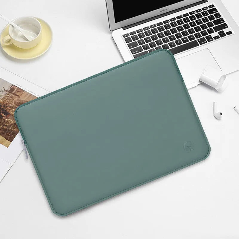 Laptop liner bag in mint green made from waterproof PU leather with shock-resistant padding, suitable for 13 to 17 inch laptops.