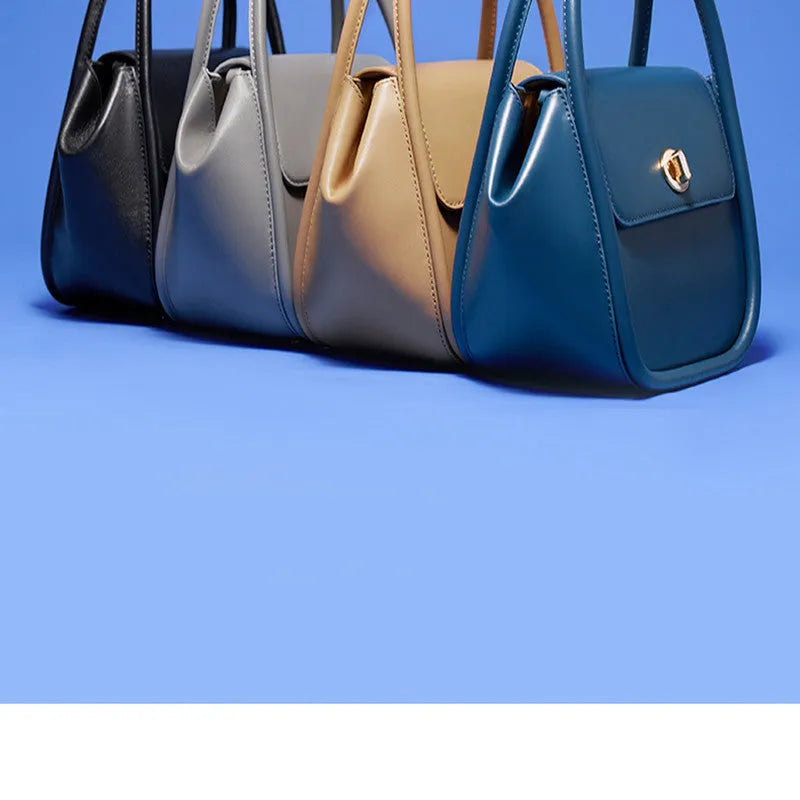 Winged shape leather tote handbag with a buckle and cross-body strap in cow leather