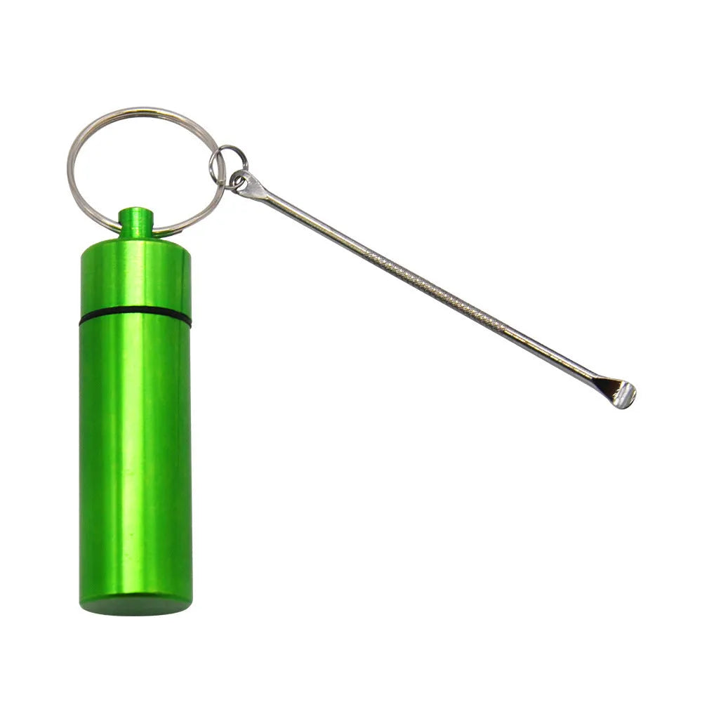 Small blue aluminium pill bottle with a silver spoon and keychain attached.