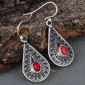 Silver-coloured water drop earrings with a red pine gemstone in a retro European style.