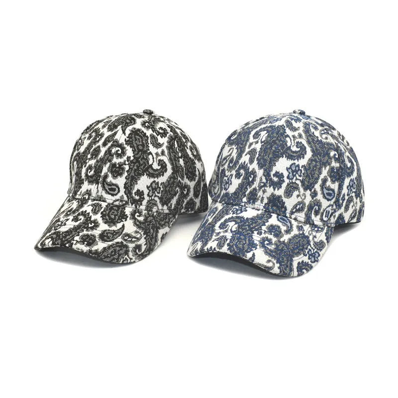Paisley pattern printed baseball cap in blue with dome crown style on a white background.