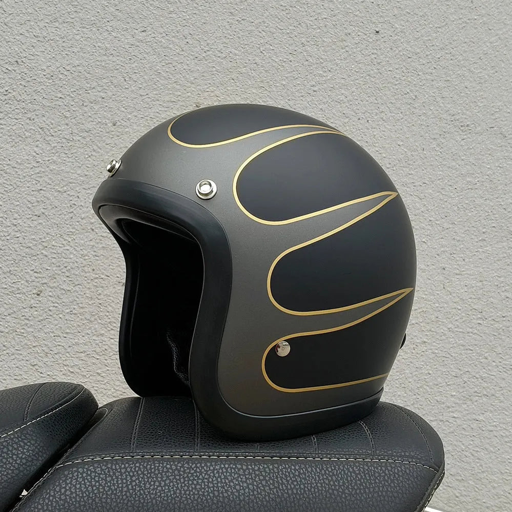Retro-style half motorcycle helmet in fibreglass, shown in Cement Grey colour on a stand.