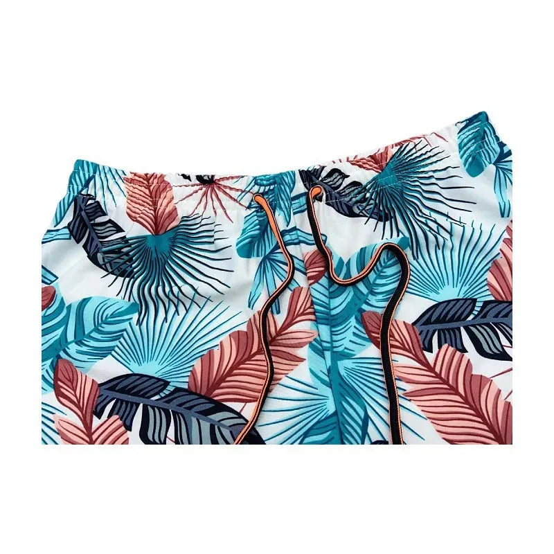 Men's cropped beach swimming trunks in multicolour leaf pattern with briefs style