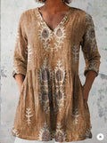 Women's printed loose dress with wide waist and 3/4 sleeves in a floral pattern.
