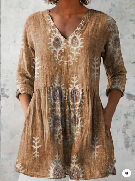 Women's printed loose dress with wide waist and 3/4 sleeves in a floral pattern.