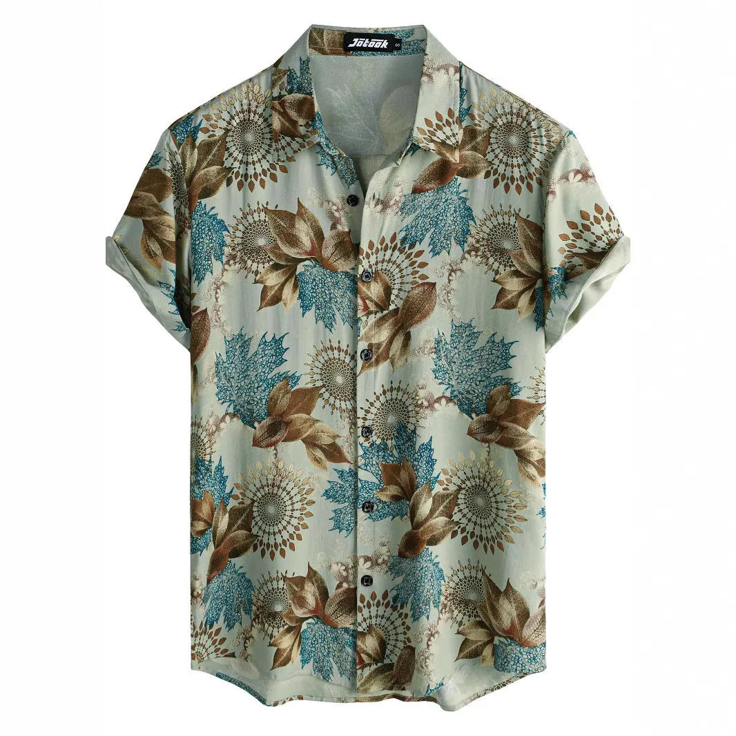 A man wearing a short sleeve floral print Hawaiian shirt with a button-up front and lapel collar.