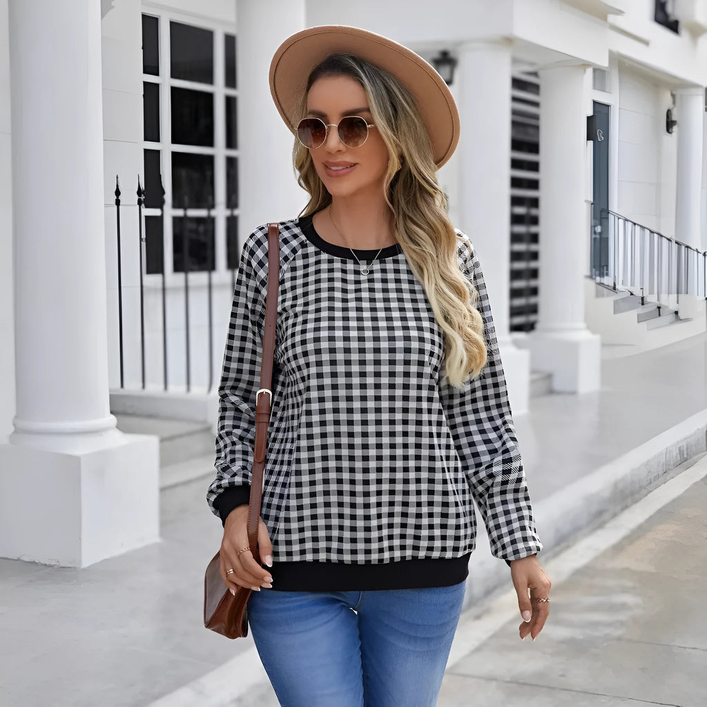 Black plaid stripe long sleeve pullover sweater laid flat, showing Japanese style pattern.