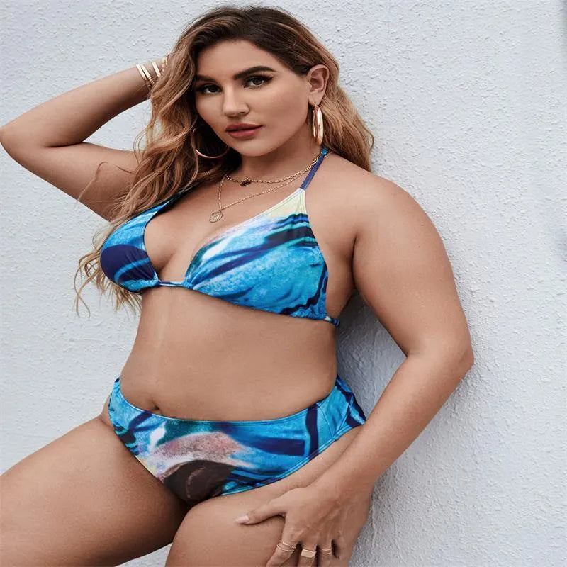 Sapphire blue women's plus-size bikini three-piece set on a neutral background.
