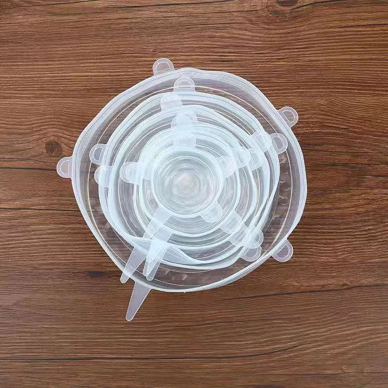 Set of six colourful silicone stretch lids in different sizes for covering bowls and food containers.