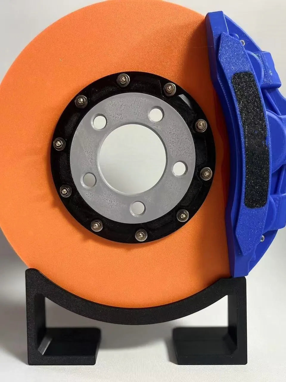Brake disc design rechargeable LED night light with touch control in blue, red or yellow.