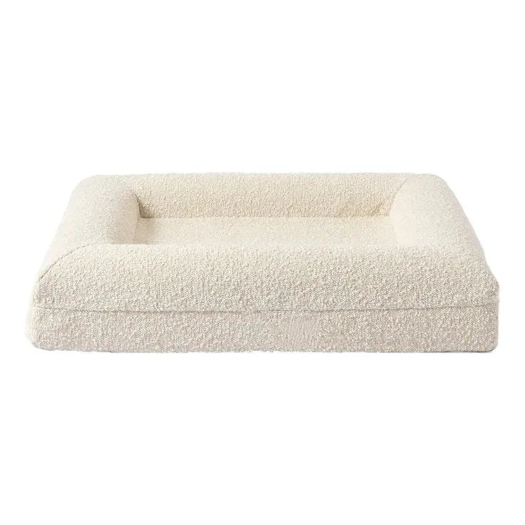 Beige rectangular cloth dog bed nest sofa for pets on a plain background