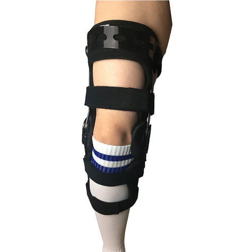 Black anterior ligament knee pad with metal stabiliser showing sandwich construction and sizing options
