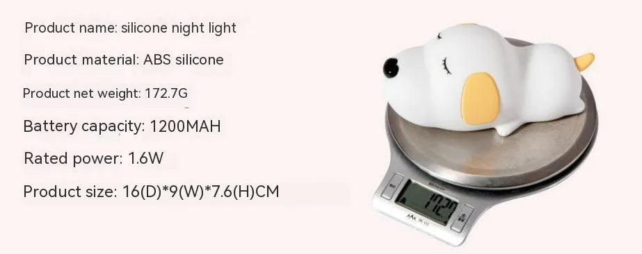 Cartoon dog design USB-charging silicone night lamp in two colours on a surface.