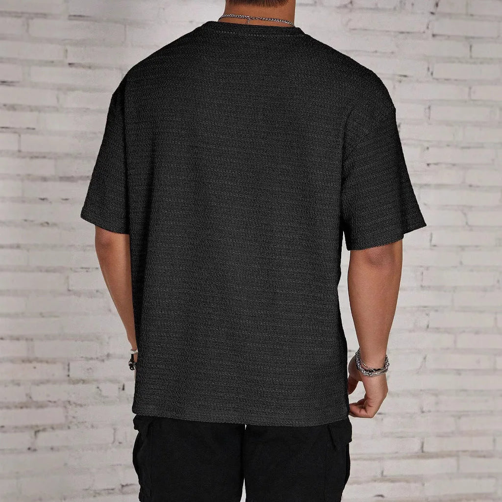 Men's slim fit short sleeve polyester t-shirt in light blue colour on a hanger
