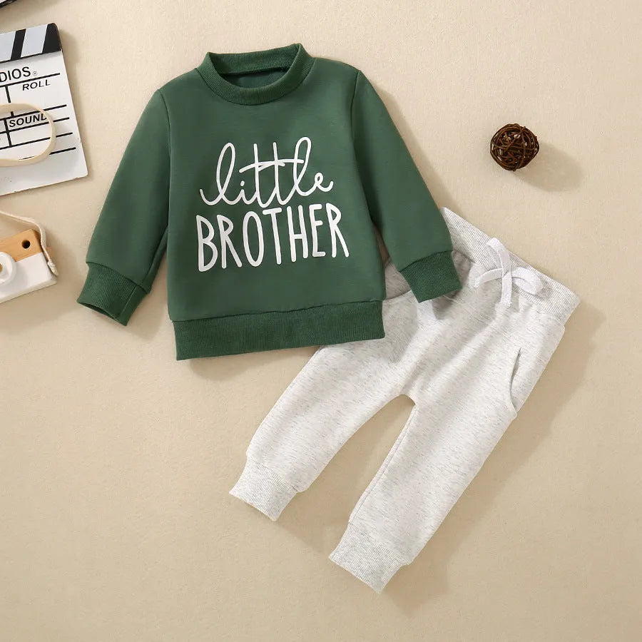 Boys and girls cotton letter long sleeve sweater suit in navy blue with matching pants set on white background.