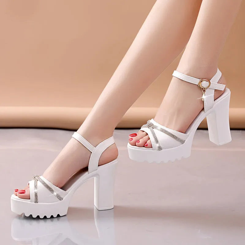 Women's black and white high heel sandals made from PU, available in sizes 35 to 42 UK.