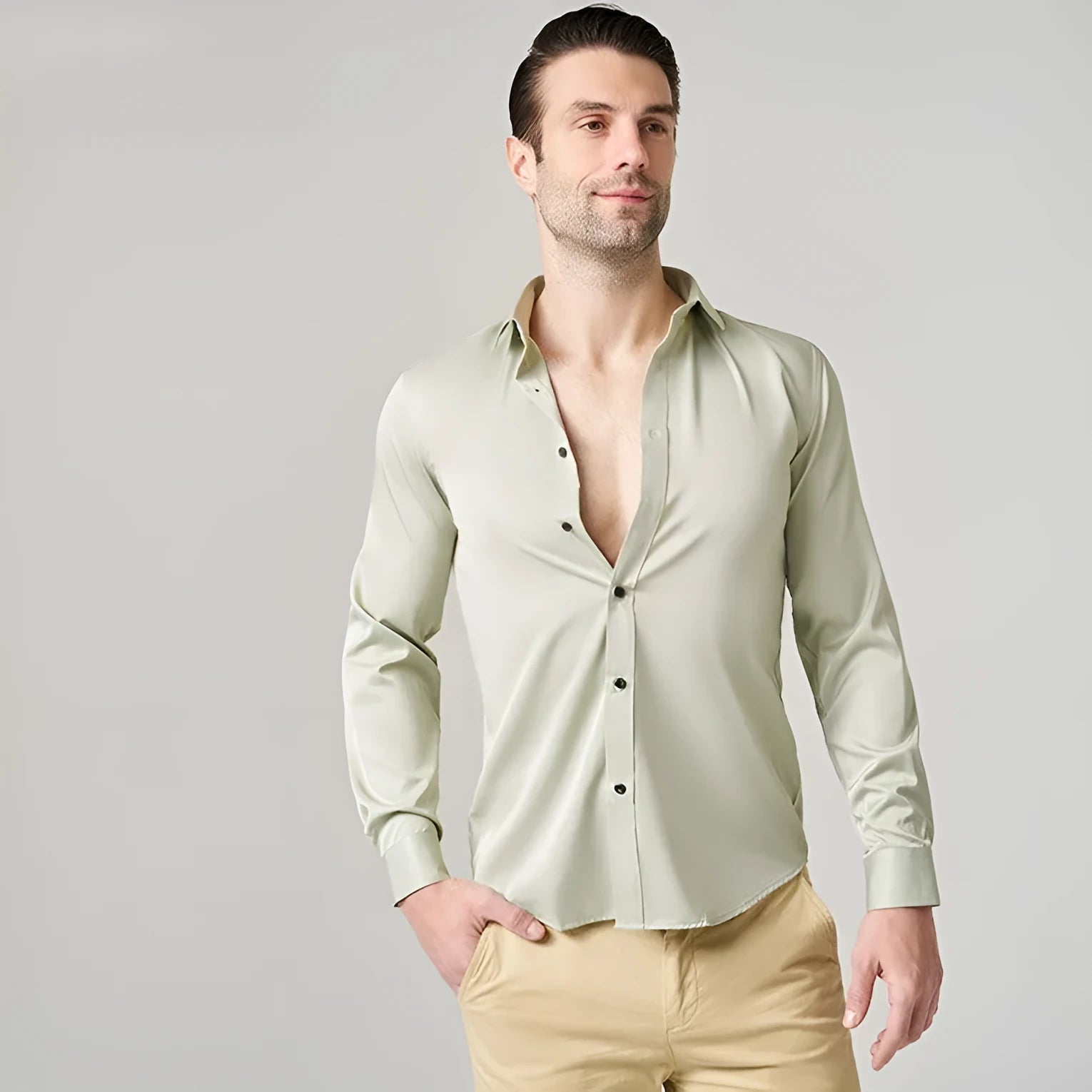 Man wearing a stretch polyester long sleeve work shirt in a blue colour, suitable for manual labour.