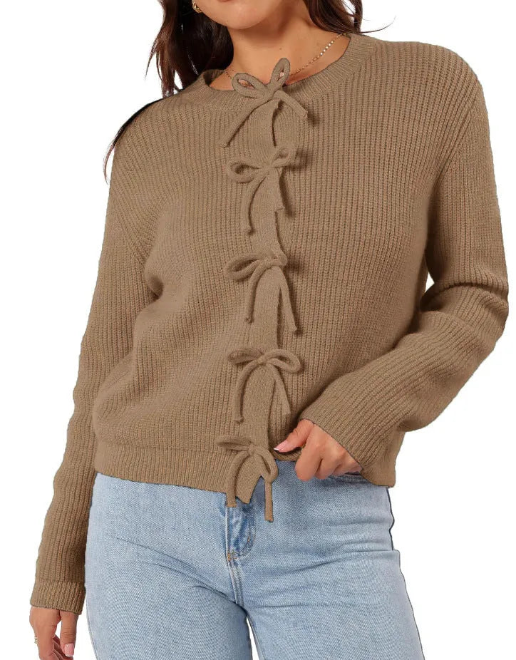 Women's long sleeve knitted cardigan with bow pattern in loose fit, available in multiple colours, shown on model