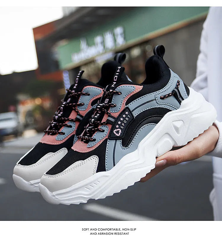 Women's white casual sports shoes with mesh upper, thick PU sole, and buckle detail