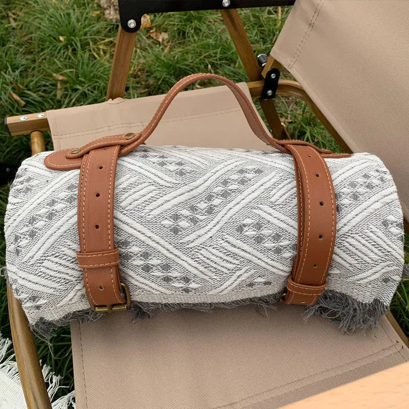 Chessboard plaid knitted picnic blanket with tassel edging and leather handle, acrylic camping rug
