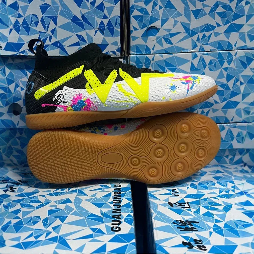 Low-top football boots in black and yellow with a PVC upper and non-slip rubber studded outsole.