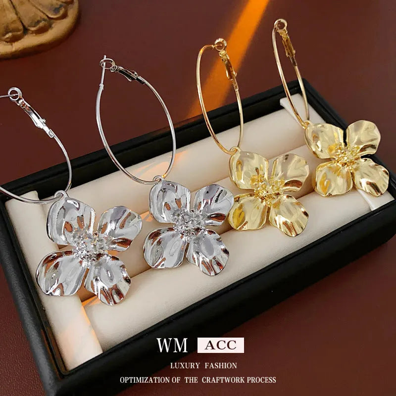 Silver Needle Metal Flower Earrings showing geometric floral pendant on long needle post in gold or silver.