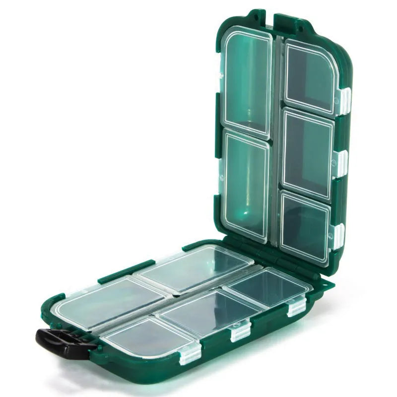 Black plastic fishing tackle storage box with 10 internal compartments, shown next to a ruler.