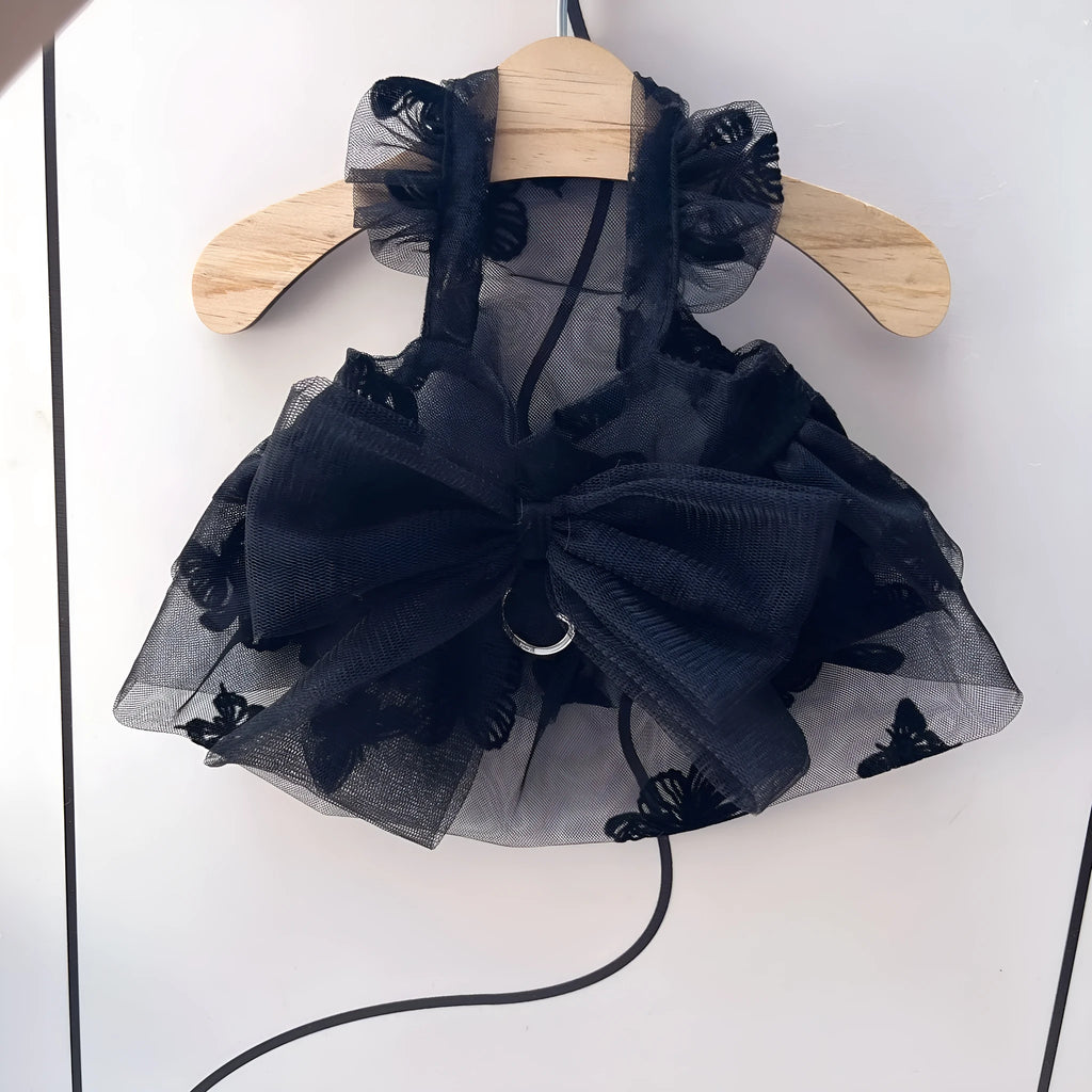Black layered tulle princess skirt on a small dog, showing chest fit and full skirt silhouette.