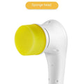 White USB rechargeable cordless electric cleaning brush with five different brush heads on a table.
