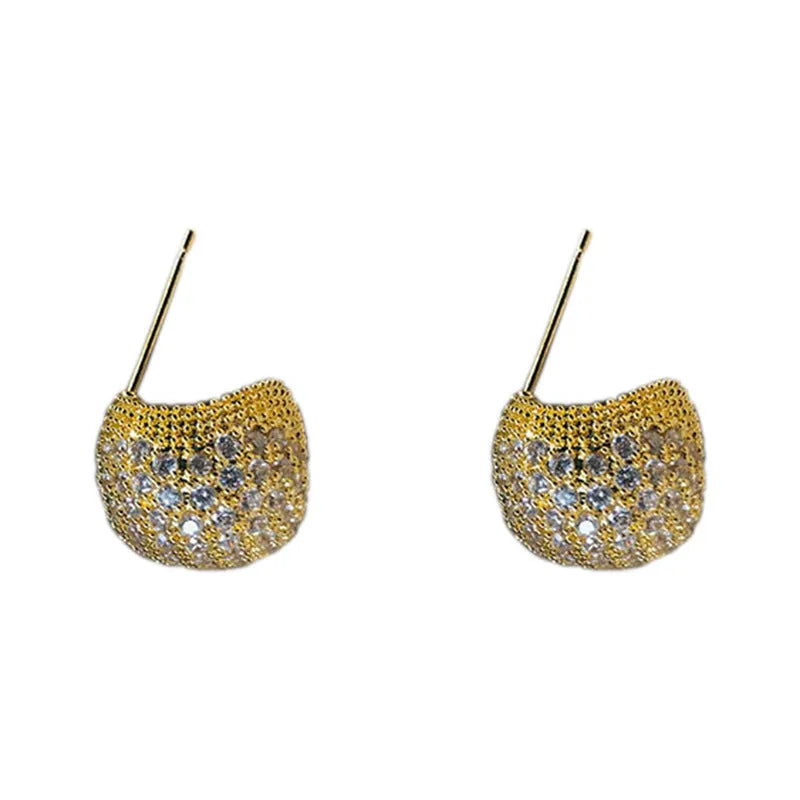 Gold and white drop-shaped geometric ear clip earrings with full diamond detailing and sphere elements
