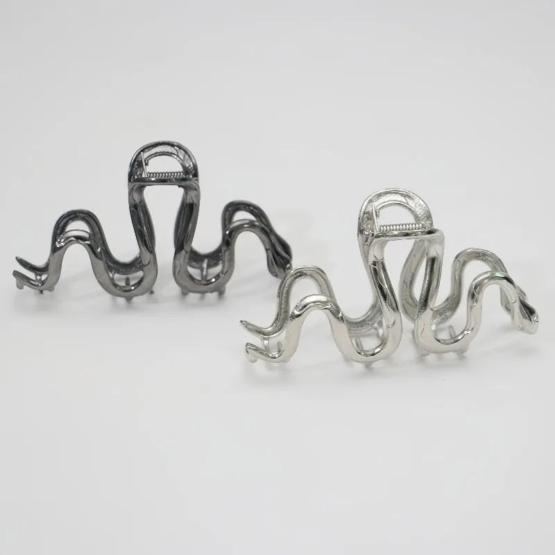 Slytherin serpentine snake design metal hair barrette in silver or gun black, measuring 10.5 cm.