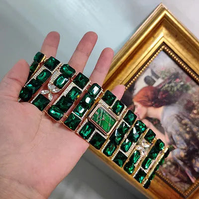 Antique court retro bracelet watch with emerald colored glaze round face and alloy bracelet