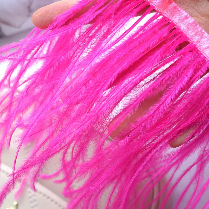 Decorative feather cloth strip in multiple colours including white, black, and mint green for DIY clothing and craft projects