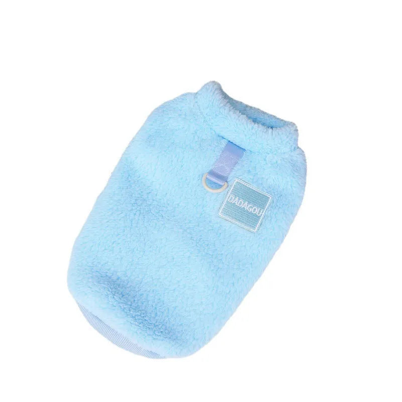 A soft coral fleece dog jacket shown in blue, available in sizes S to XXL.