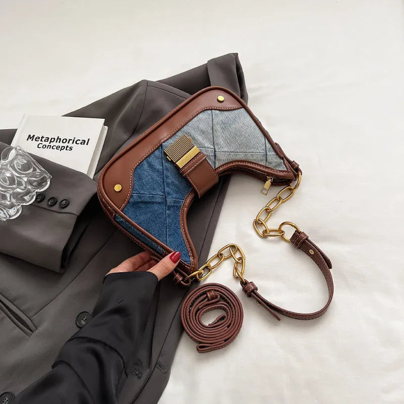 Brown denim women's shoulder bag with diamond mesh and chain detail, bucket shape.