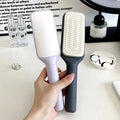 Roland purple self-cleaning hair brush with rotating telescopic handle and anti-static bristles.