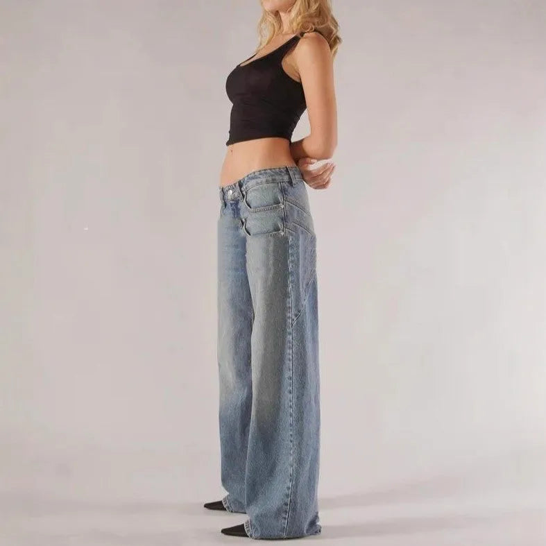 Blue loose straight wide leg cotton trousers with low waist and stitching detail on a model.