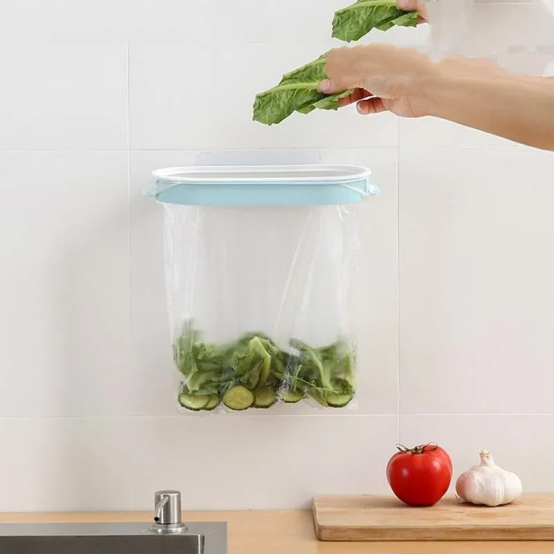 Blue plastic kitchen garbage bag storage rack on a cabinet holding rubbish bags