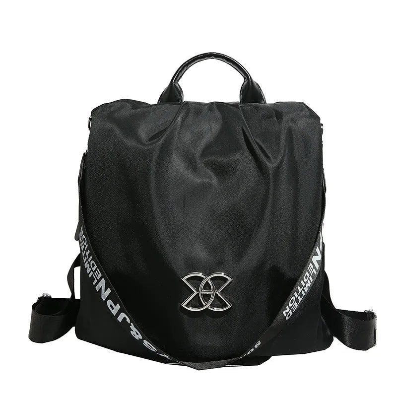 Women's black travel backpack with contrast stitching, large capacity, and three-dimensional outer pocket