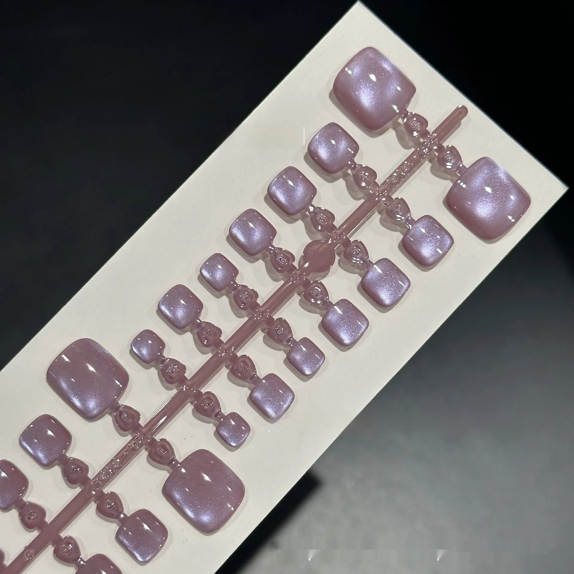 Purple cat eye toenail wear set with micro glass bead crystal effect and icy finish close up