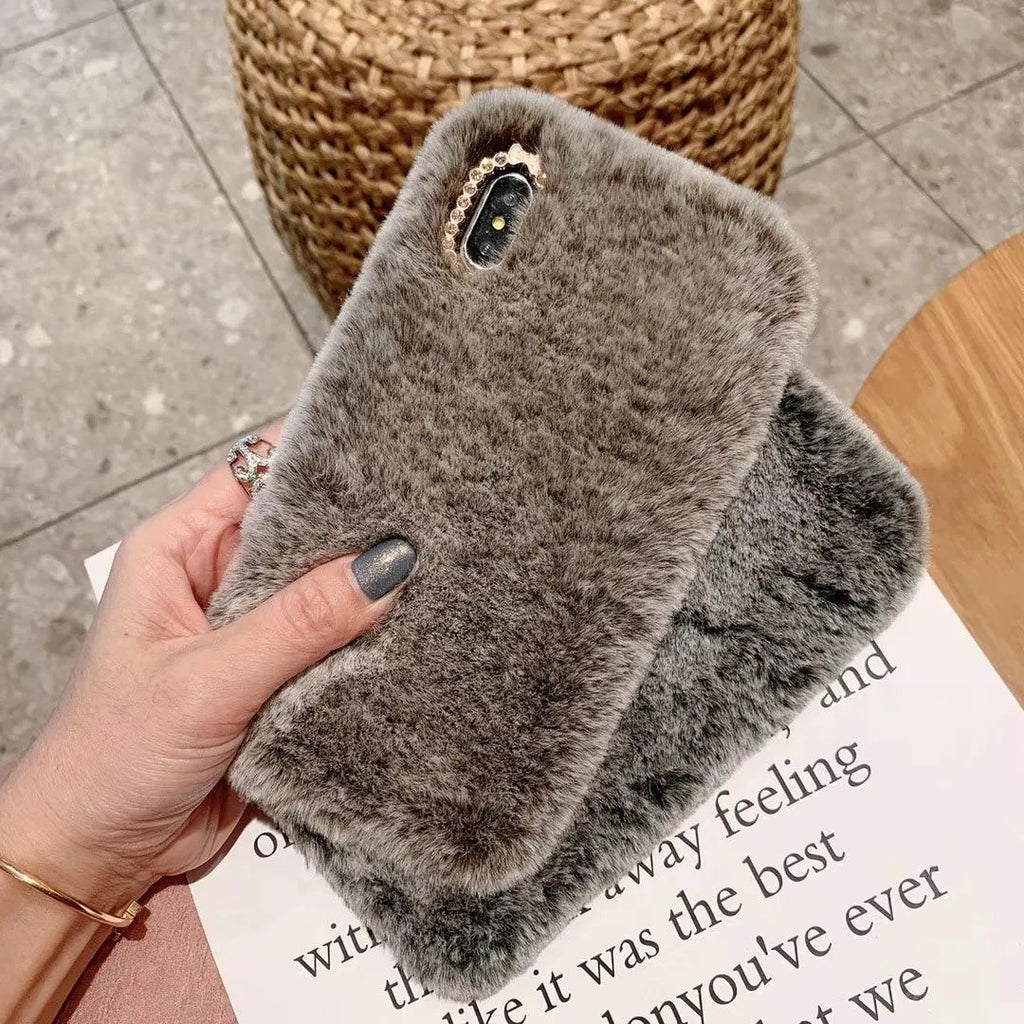 Silicone iPhone protective case with rhinestone decoration and a soft plush bottom shell.