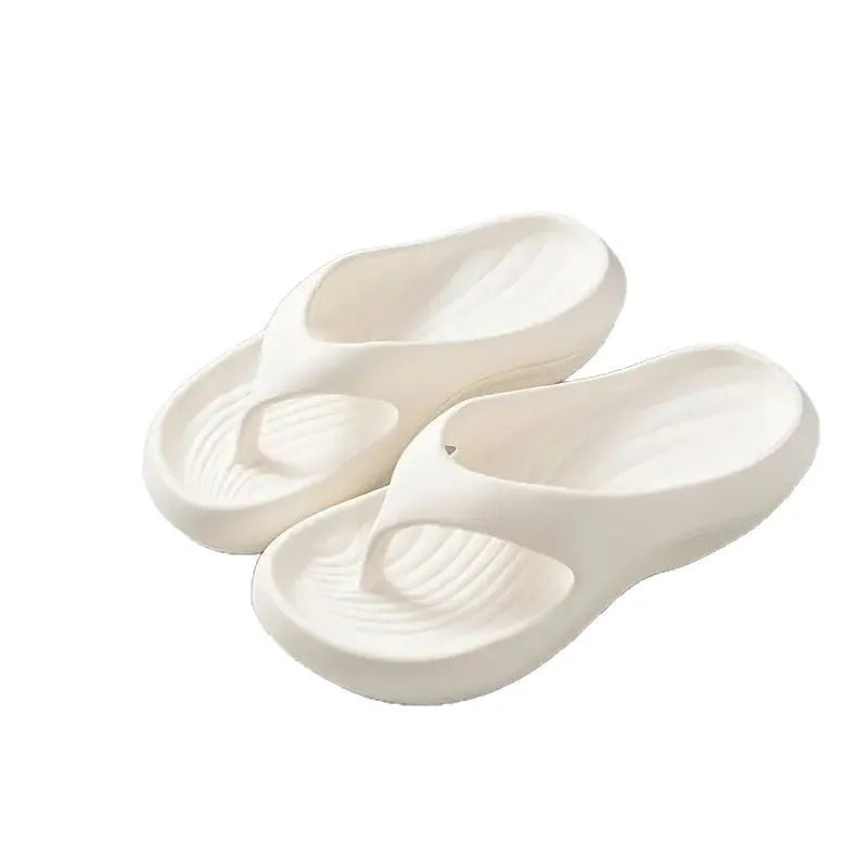 Women's thick-soled flip-flops in black, white and grey colours with non-slip EVA construction
