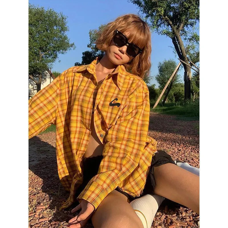 Dopamine Yellow and black plaid pattern on a loose-fitting unisex cardigan-style shirt.
