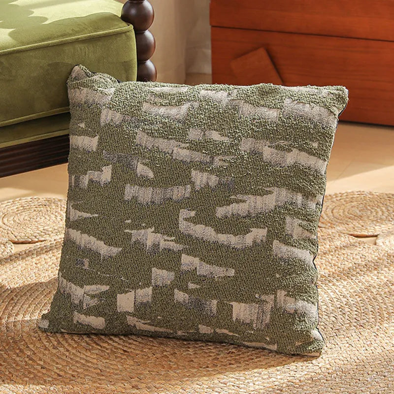 Square 45cm jacquard cushion cover with retro floral pattern in Nordic style on a grey sofa.