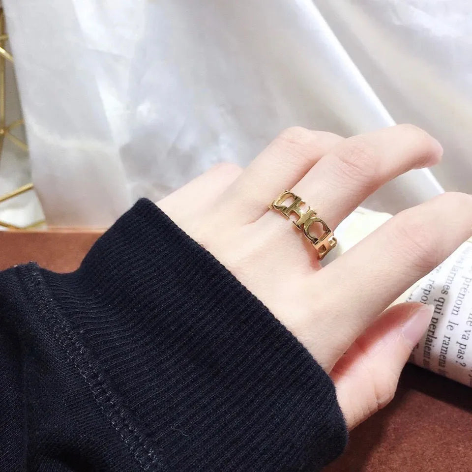 Gold titanium steel unisex letter ring with hollowed cut design, sizes 6 to 9