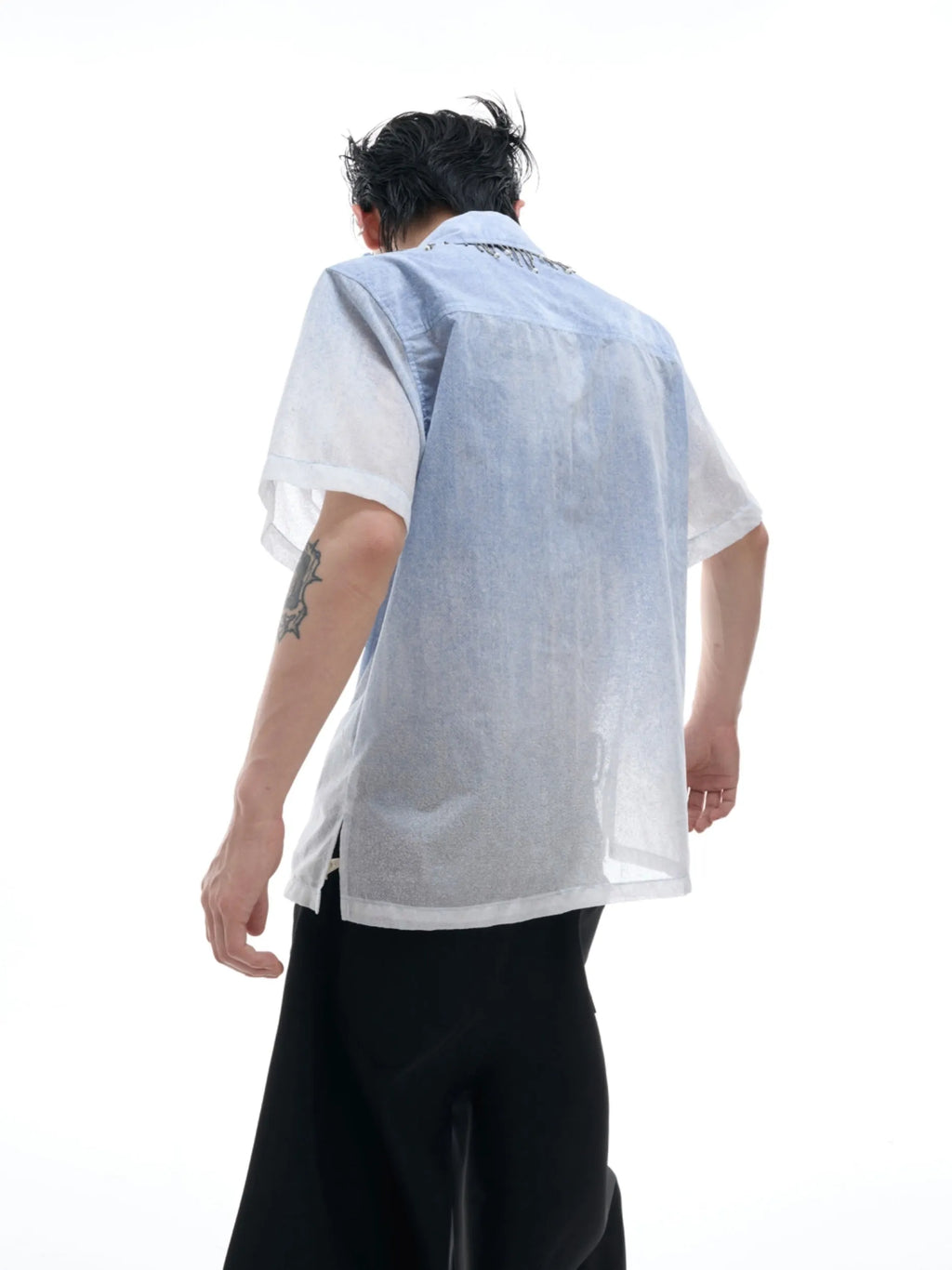 Man wearing a blue and white gradient loose-fit casual half-sleeve summer shirt