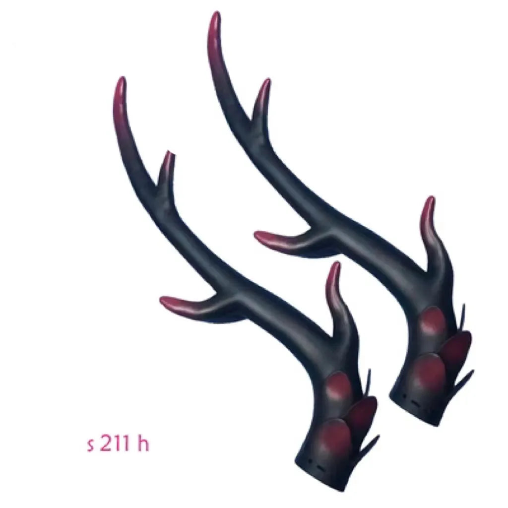 A pair of black resin dragon horn decorations for motorcycle helmet customisation, showing curved shape and mounting base.